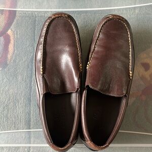 Cole Haan brown leather slip on shoes.